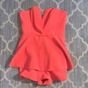 Bright orange strapless romper